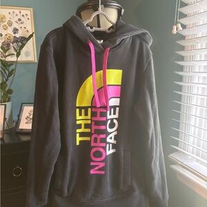 The North Face Black Hoodie with Vibrant Pink and Yellow Accents